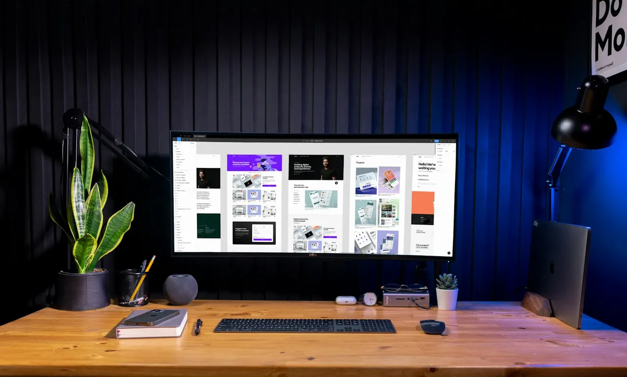 Silver imac on brown wooden table