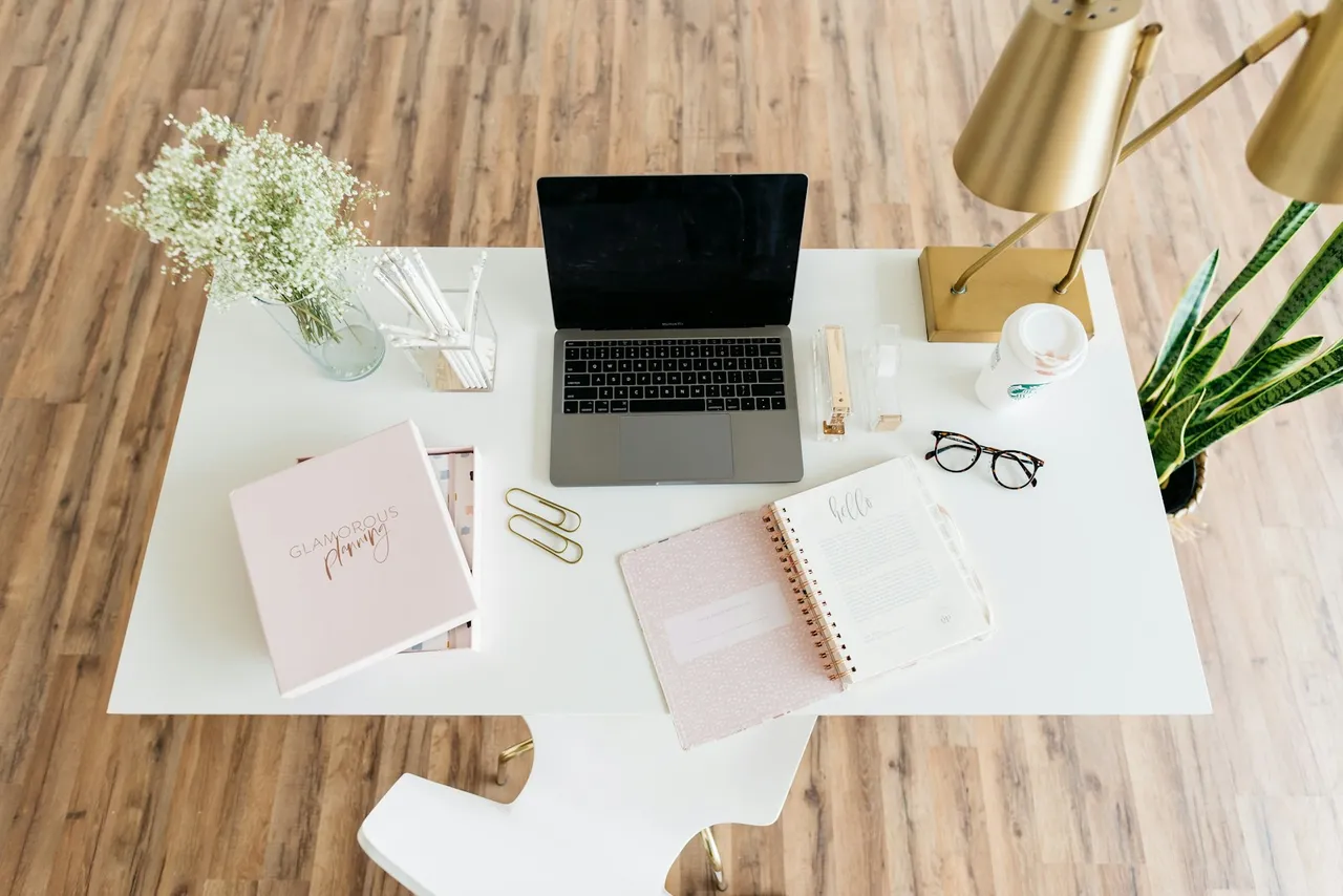 A laptop and appointment planner on a desk