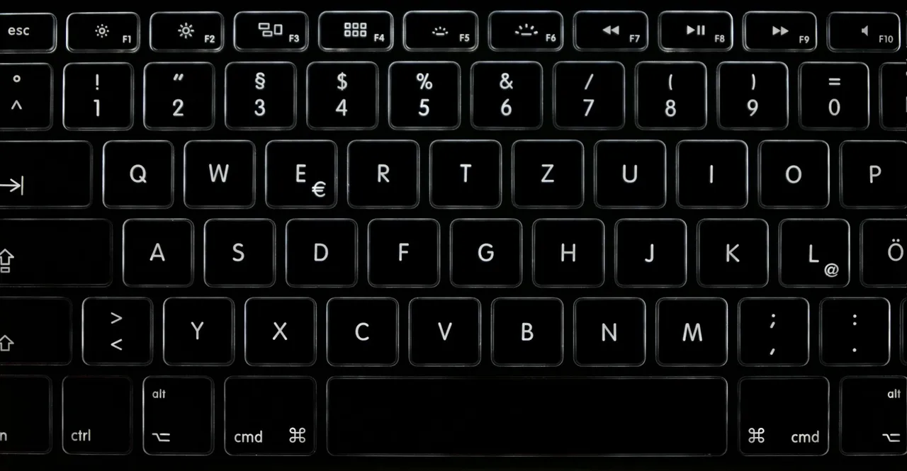 Close-up of an illuminated black computer keyboard