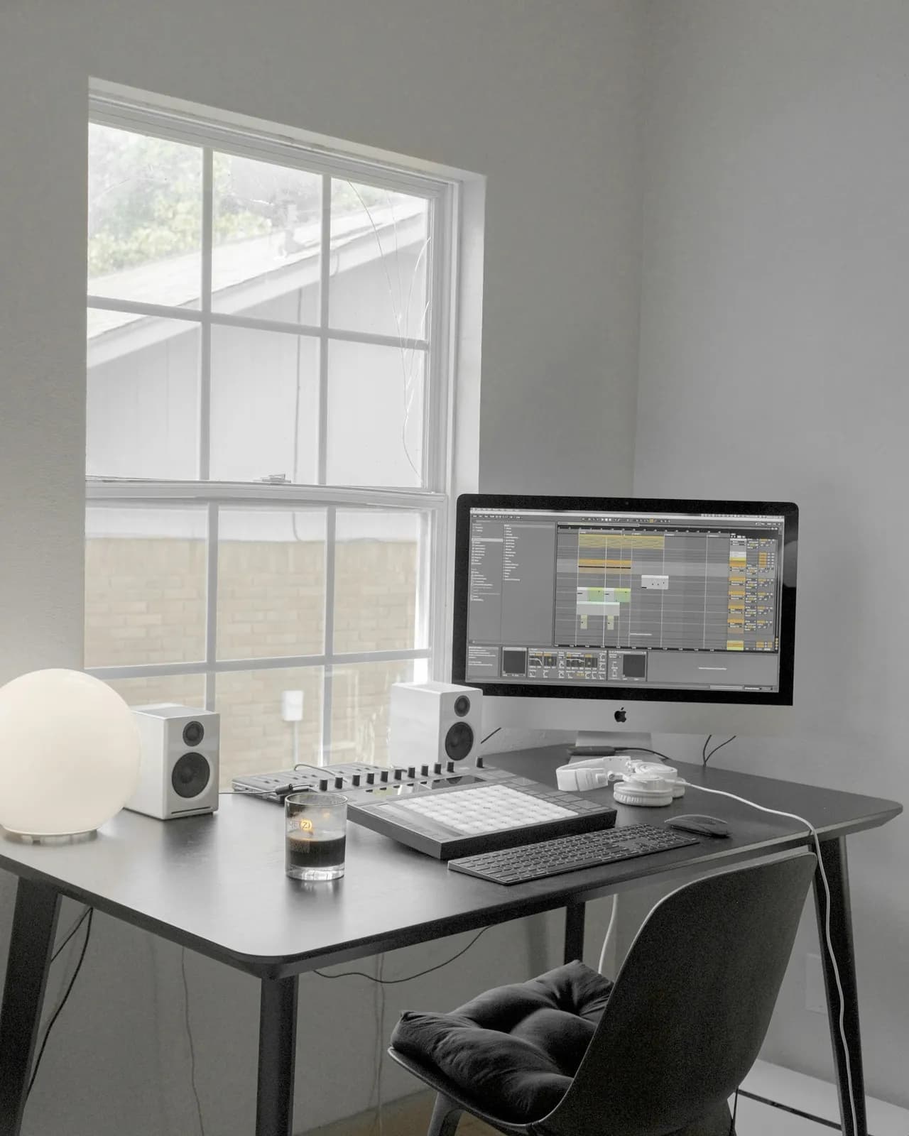 Black flat screen computer monitor on white wooden desk