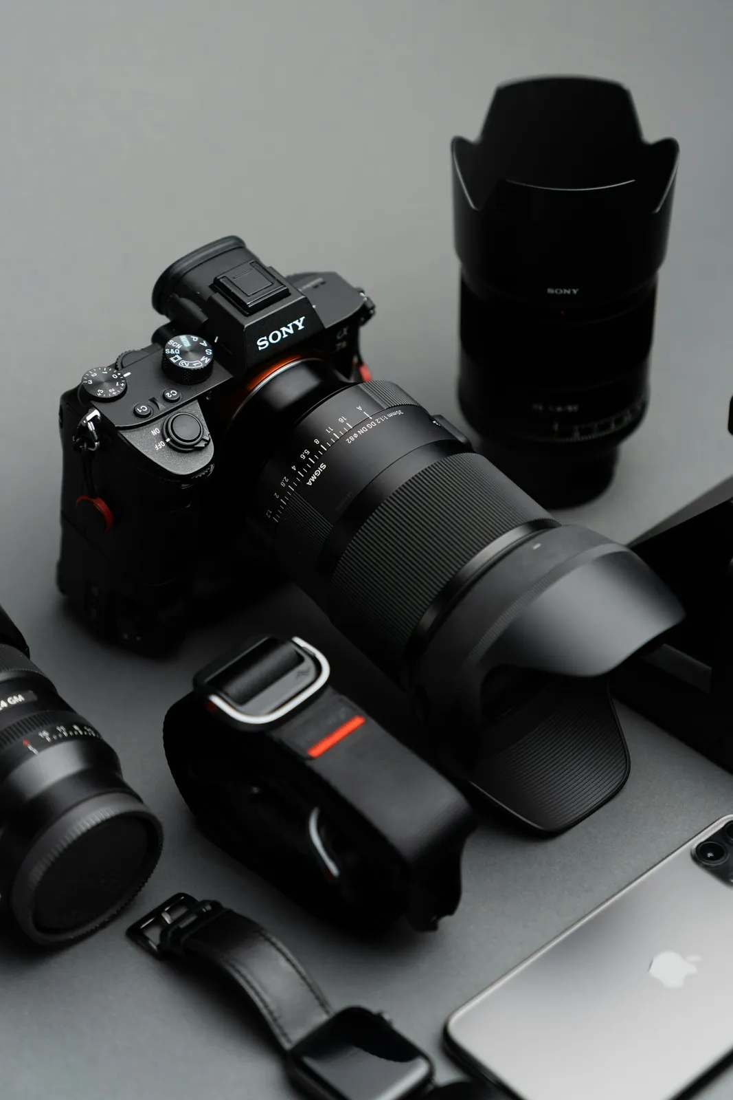 Sony mirrorless camera and lens photographed on a desk