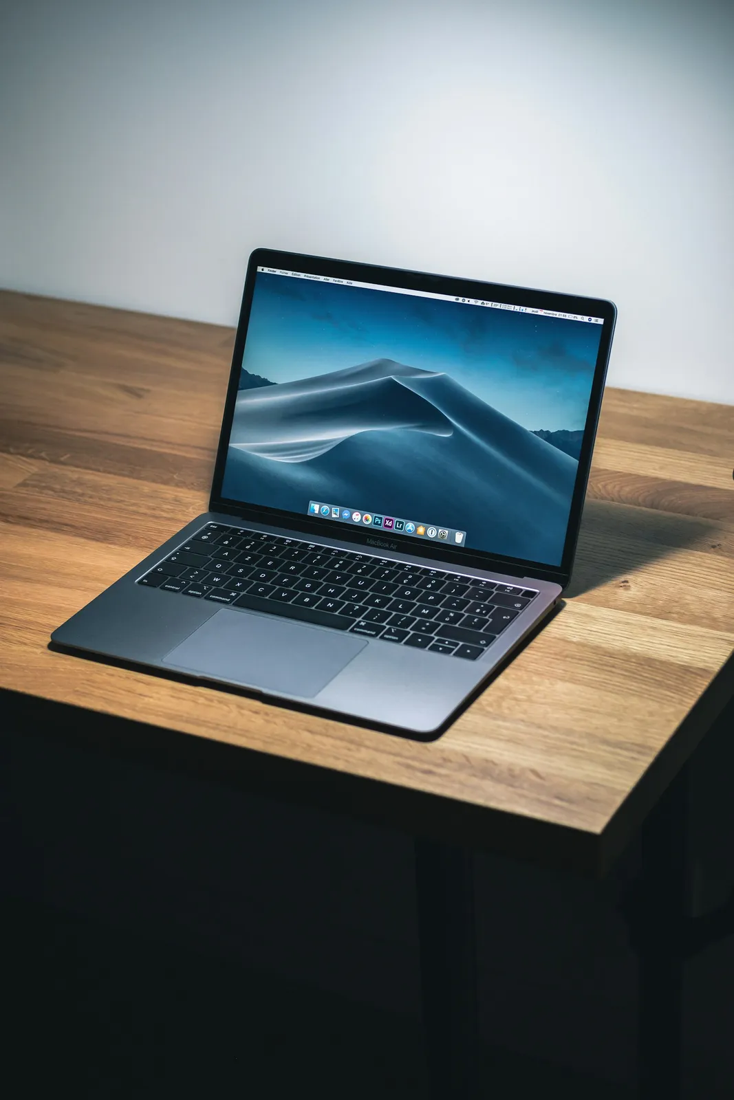 Open macbook air on wooden desk